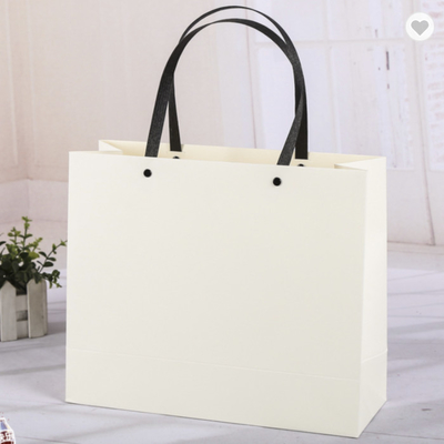 Giá tốt. Bao bì túi giấy Kraft màu Pantone với tay cầm tổng hợp trực tuyến